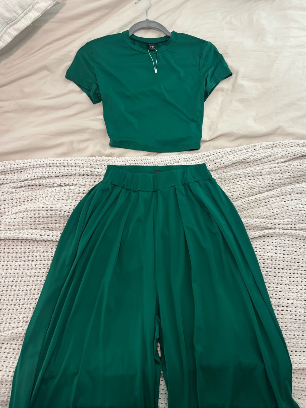 2 pc set. Crew neck short sleeved cropped top and matching wide leg pants.